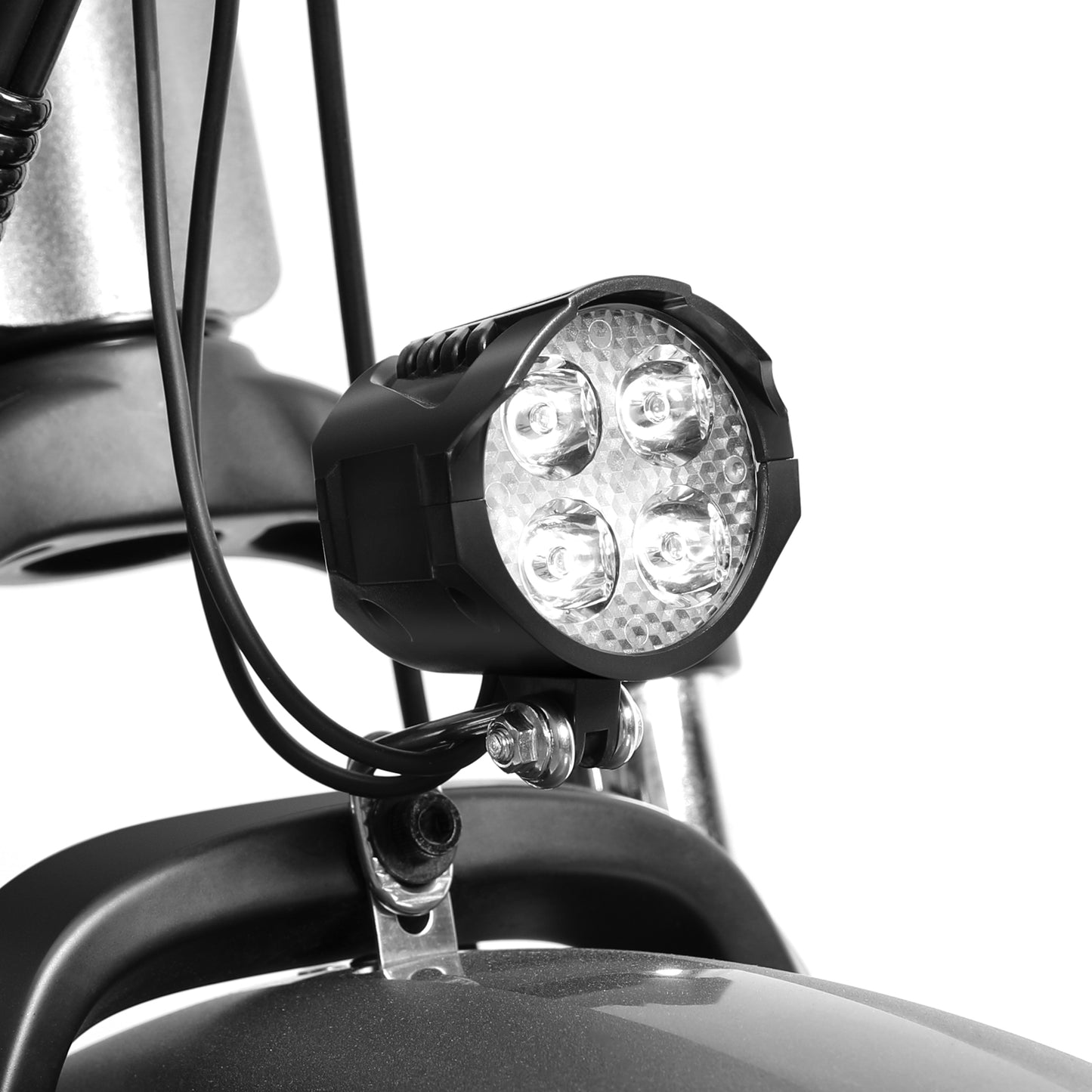 Close-up of a motorcycle light fixture on a white background