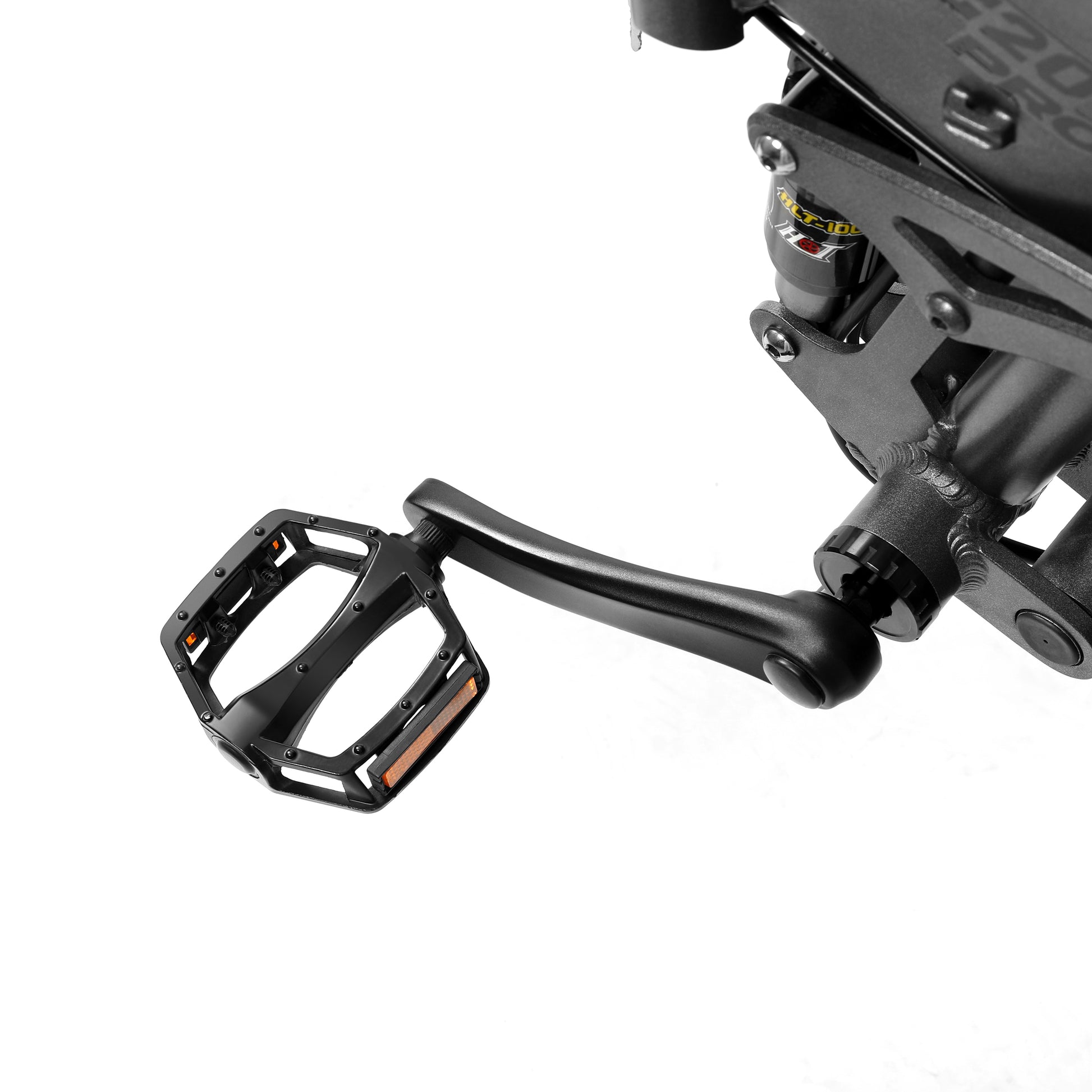 Close-up of a motorcycle foot peg and brake lever on a white background